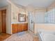 Bathroom with wood vanity, tub/shower, and tile flooring at 920 Tuscanny St, Brandon, FL 33511