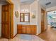 Bathroom with wood vanity, decorative mirror, and tile flooring at 920 Tuscanny St, Brandon, FL 33511
