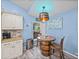 Eat-in dining area with unique wine barrel table, stainless steel appliances and cabinetry at 920 Tuscanny St, Brandon, FL 33511