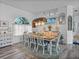 Dining room featuring hardwood floors and views into the living area at 920 Tuscanny St, Brandon, FL 33511