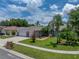 Well-maintained single-story home with lush landscaping and a brick mailbox at 920 Tuscanny St, Brandon, FL 33511