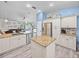 Open kitchen with stone countertops, stainless steel appliances, breakfast bar, and eat-in dining at 920 Tuscanny St, Brandon, FL 33511