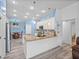 Well-lit kitchen with stone countertops, an island, breakfast bar and stainless steel appliances at 920 Tuscanny St, Brandon, FL 33511