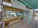 Inviting outdoor bar area with a TV, open layout, and access to the screened patio at 920 Tuscanny St, Brandon, FL 33511