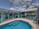 Outdoor bar featuring ample seating, a built-in grill, and an inviting atmosphere for entertaining at 920 Tuscanny St, Brandon, FL 33511