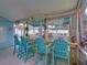 Outdoor bar area includes an outdoor kitchen, granite countertops, barstool seating, and decorative signage at 920 Tuscanny St, Brandon, FL 33511