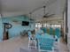 Charming covered patio featuring a colorful bar, lounge area, and outdoor seating for relaxation and entertaining at 920 Tuscanny St, Brandon, FL 33511