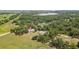 An aerial view of a home on a spacious lot with scenic countryside views and mature trees at 9819 Allen Rd, Lithia, FL 33547