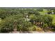Sprawling rural property boasting lush greenery and a charming home nestled among mature trees at 9819 Allen Rd, Lithia, FL 33547