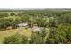Aerial view of the property's expansive land, residence, and outbuildings at 9819 Allen Rd, Lithia, FL 33547