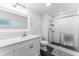 Modern bathroom features sleek vanity, stylish fixtures, and a glass-enclosed shower with updated tiling at 9819 Allen Rd, Lithia, FL 33547