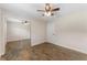 This is a spacious bedroom featuring light walls and wood-look flooring at 9819 Allen Rd, Lithia, FL 33547