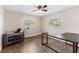 This bedroom features a crib and desk alongside light filled windows at 9819 Allen Rd, Lithia, FL 33547
