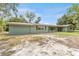 Side view of a one story home featuring shuttered windows at 9819 Allen Rd, Lithia, FL 33547