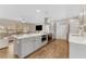 Bright, open kitchen featuring a large center island, stainless steel appliances, and a seamless transition to the living area at 9819 Allen Rd, Lithia, FL 33547