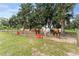 Cows standing next to a fence with red feed containers at 9819 Allen Rd, Lithia, FL 33547