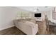 Open concept living room with large windows and comfortable seating at 9819 Allen Rd, Lithia, FL 33547