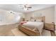 Large main bedroom with neutral walls, ceiling fans, and ample closet space, plus a cozy queen bed at 9819 Allen Rd, Lithia, FL 33547