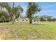 Exterior shot of an outbuilding with a black truck visible in the background at 9819 Allen Rd, Lithia, FL 33547