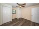 Bright bedroom features laminate flooring, a ceiling fan, and two spacious closets at 8184 49Th N Ave, St Petersburg, FL 33709