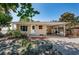 Charming single-story home with a covered carport and well-maintained front yard at 8184 49Th N Ave, St Petersburg, FL 33709