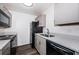 Updated kitchen showcasing stainless steel sink, appliances, speckled counters, and cabinets at 8184 49Th N Ave, St Petersburg, FL 33709