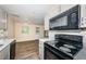 Bright kitchen features modern appliances, speckled countertops, and new wooden floors at 8184 49Th N Ave, St Petersburg, FL 33709