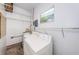 This laundry room features a washer, dryer, water heater, and storage shelves at 8184 49Th N Ave, St Petersburg, FL 33709