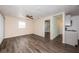 Open living room and kitchen featuring modern flooring, a ceiling fan, and neutral colored walls at 8184 49Th N Ave, St Petersburg, FL 33709