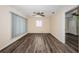Open living room featuring modern flooring, a ceiling fan, and neutral colored walls at 8184 49Th N Ave, St Petersburg, FL 33709