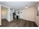 Open living area with kitchen and dining area, including updated flooring and neutral paint at 8184 49Th N Ave, St Petersburg, FL 33709