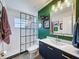 Modern bathroom with a glass-enclosed shower, sleek vanity, and stylish finishes creating a spa-like retreat at 7516 S Mascotte St, Tampa, FL 33616