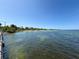 Scenic view of the calm, clear waters and sandy beach at Picnic Island Park at 7516 S Mascotte St, Tampa, FL 33616