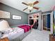 Comfortable bedroom with closet and ensuite bathroom, showcasing soothing gray walls and bright accents at 7516 S Mascotte St, Tampa, FL 33616