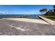 Public boat ramp with a fishing pier at Picnic Island Park on a clear day at 7516 S Mascotte St, Tampa, FL 33616
