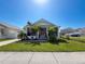 Charming home featuring a screened porch and beautiful landscaping in a desirable neighborhood at 7516 S Mascotte St, Tampa, FL 33616