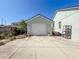 Detached garage with a wide driveway offering plenty of parking and storage options at 7516 S Mascotte St, Tampa, FL 33616