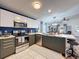 Modern kitchen with stainless steel appliances and sleek countertops, great for cooking at 7516 S Mascotte St, Tampa, FL 33616