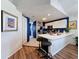 Modern kitchen with sleek white countertops and an island with bar stool seating at 7516 S Mascotte St, Tampa, FL 33616