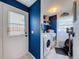 Bright laundry room featuring new appliances and ample space at 7516 S Mascotte St, Tampa, FL 33616