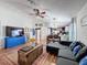 An open floor plan showcases the living room leading into the dining and kitchen area at 7516 S Mascotte St, Tampa, FL 33616