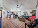 Spacious living room with wood floors flowing into an open floorplan with kitchen access at 7516 S Mascotte St, Tampa, FL 33616