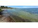 Picturesque shoreline view at Picnic Island Park with gentle waves and clear water at 7516 S Mascotte St, Tampa, FL 33616