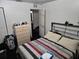 Cozy bedroom with comfortable bed and dresser storage, offering a relaxing retreat at 1000 13Th S Ave, St Petersburg, FL 33705