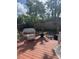 Relaxing backyard patio featuring a cozy outdoor seating area with surrounding greenery at 10185 Santiago Ct, Seminole, FL 33776