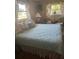 Comfortable bedroom with coordinated bedding and curtains, providing a peaceful retreat at 10185 Santiago Ct, Seminole, FL 33776