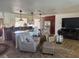 Open concept living area with a modern kitchen, island, and comfortable seating at 10185 Santiago Ct, Seminole, FL 33776