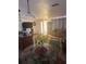 Inviting living room area featuring a glass table with sunflower centerpiece, with easy access to other living spaces at 10185 Santiago Ct, Seminole, FL 33776