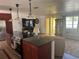 Bright and airy living room with seamless flow and access to the other living spaces at 10185 Santiago Ct, Seminole, FL 33776