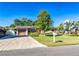 Charming single-story home with a well-maintained lawn and inviting curb appeal on a sunny day at 10218 N Fleetwood Dr, Tampa, FL 33612